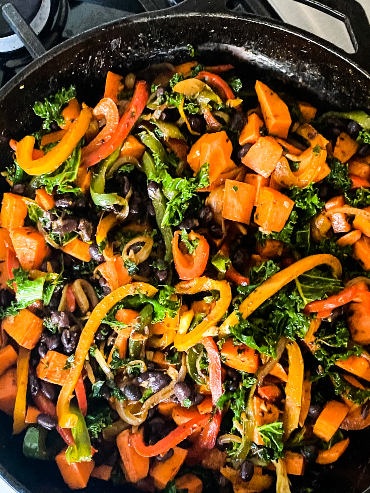 sweet potato kale and peppers in a skillet