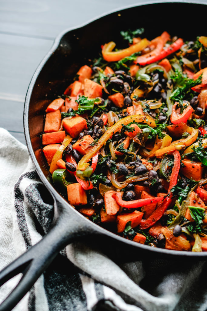 sweet potato kale and peppers in a skillet