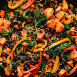 sweet potato kale and peppers in a skillet