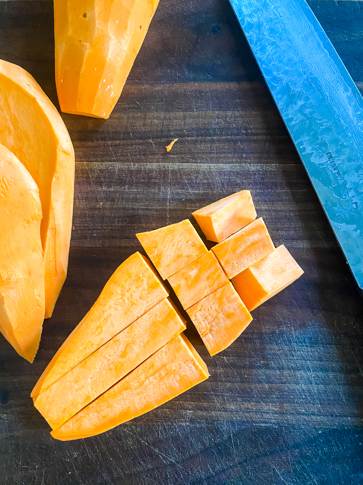 cut up sweet potatoes on chopping board