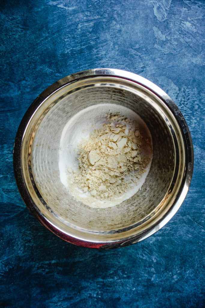 rice flour and besan measured out in a bowl