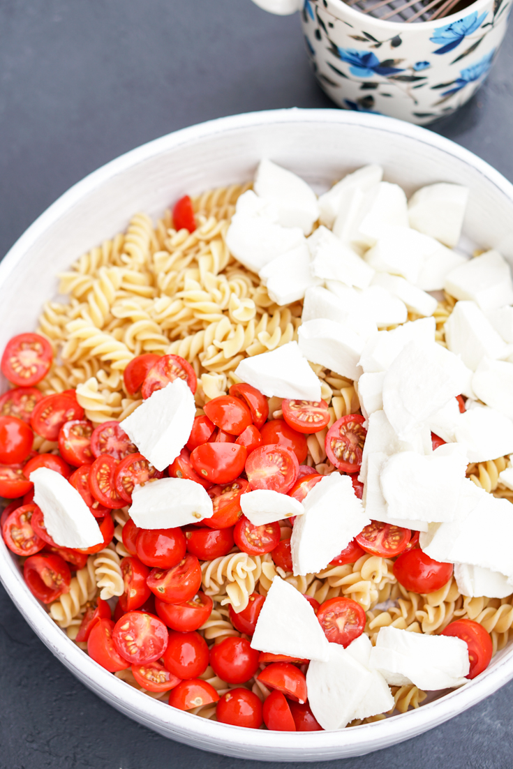oasta, tomatoes and mozzarella in a white bowl