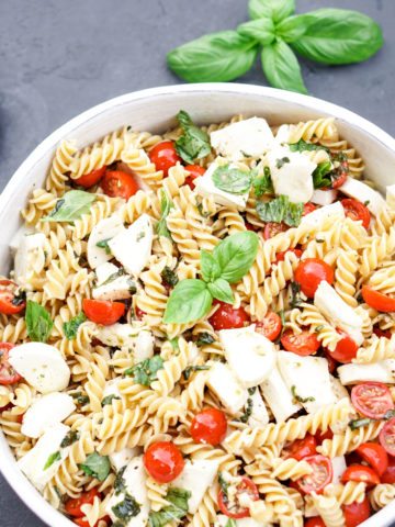 caprese pasta salad in a white bowl