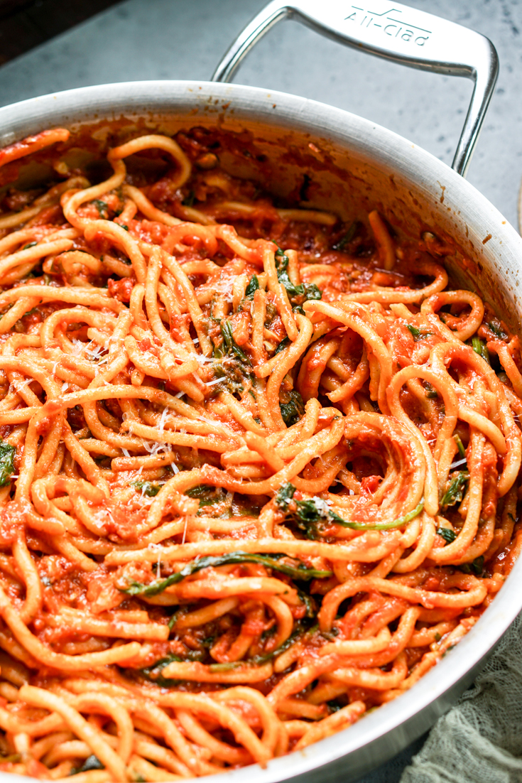 spaghetti with marinara sauce in a pan