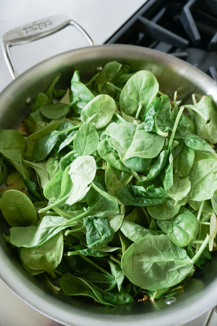 baby spinach piled up in a pot