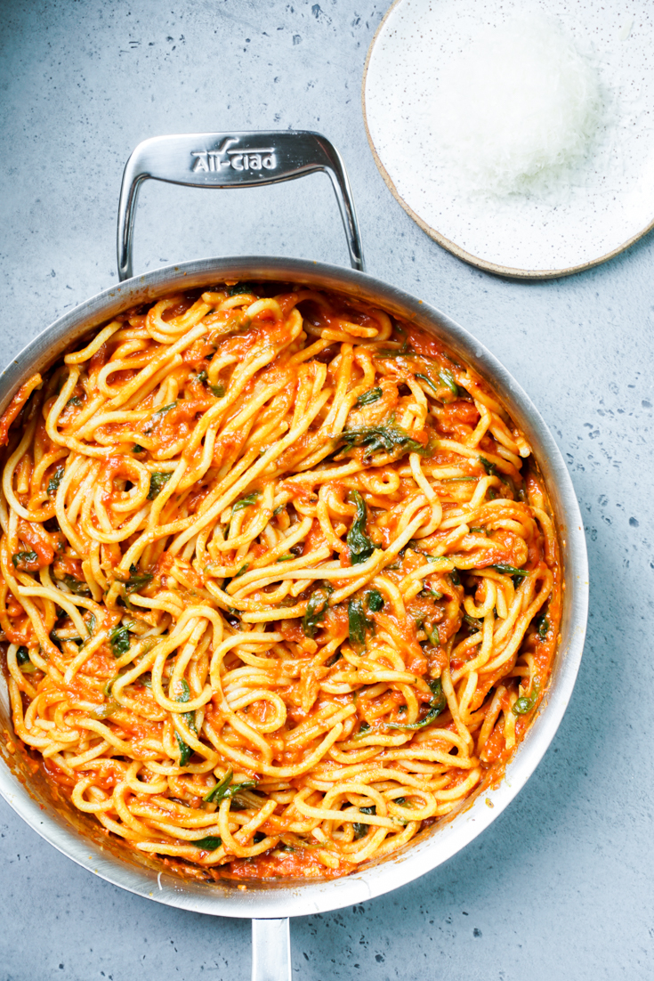 spaghetti with marinara sauce in a pan