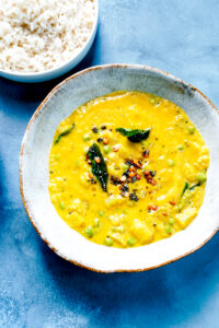 a bowl of rice, dal kootu curry