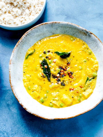 a bowl of rice, dal kootu curry