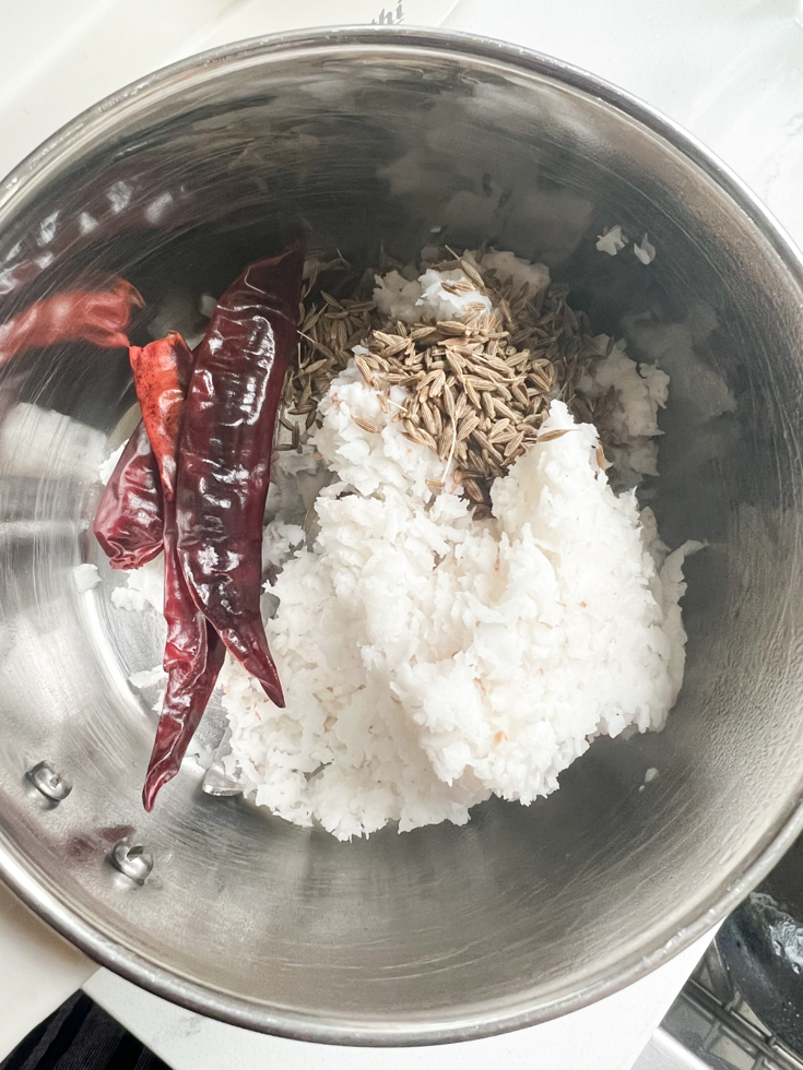 coconut, cumin and chillies in a blender jar