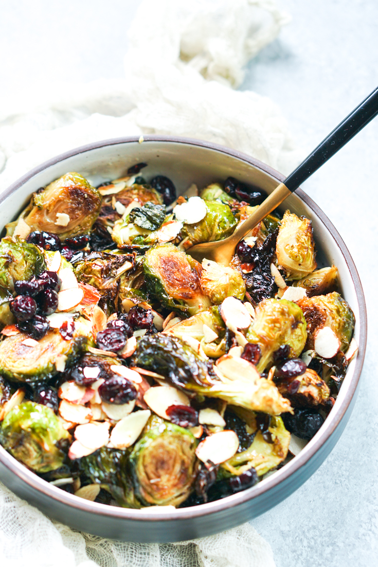 brussels sprouts in a shallow bowl with a fork in it