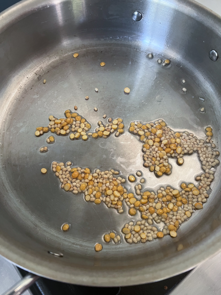 lentils in coconut oil in a pan