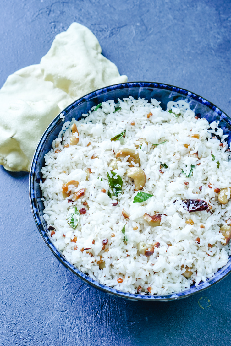 a blue bowl with coconut rice in it