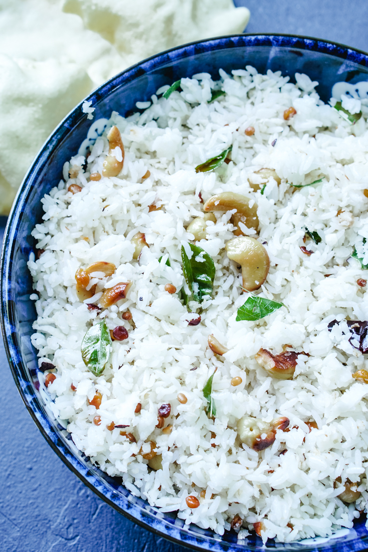 a blue bowl with coconut rice in it