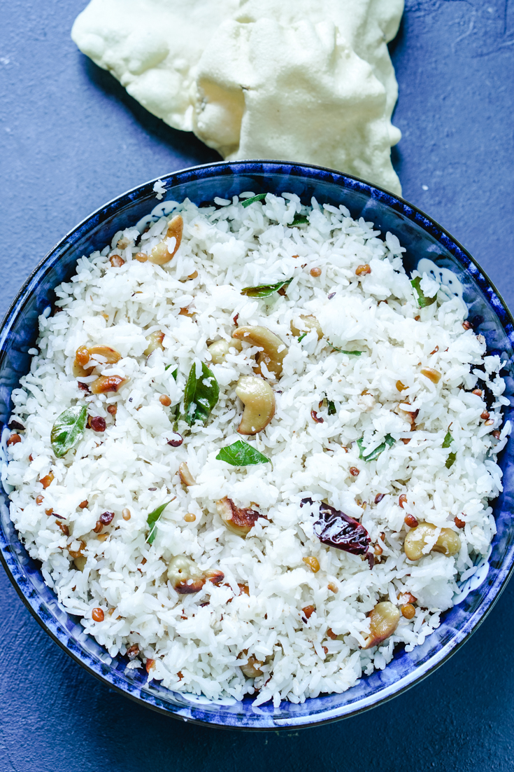 a blue bowl with coconut rice in it