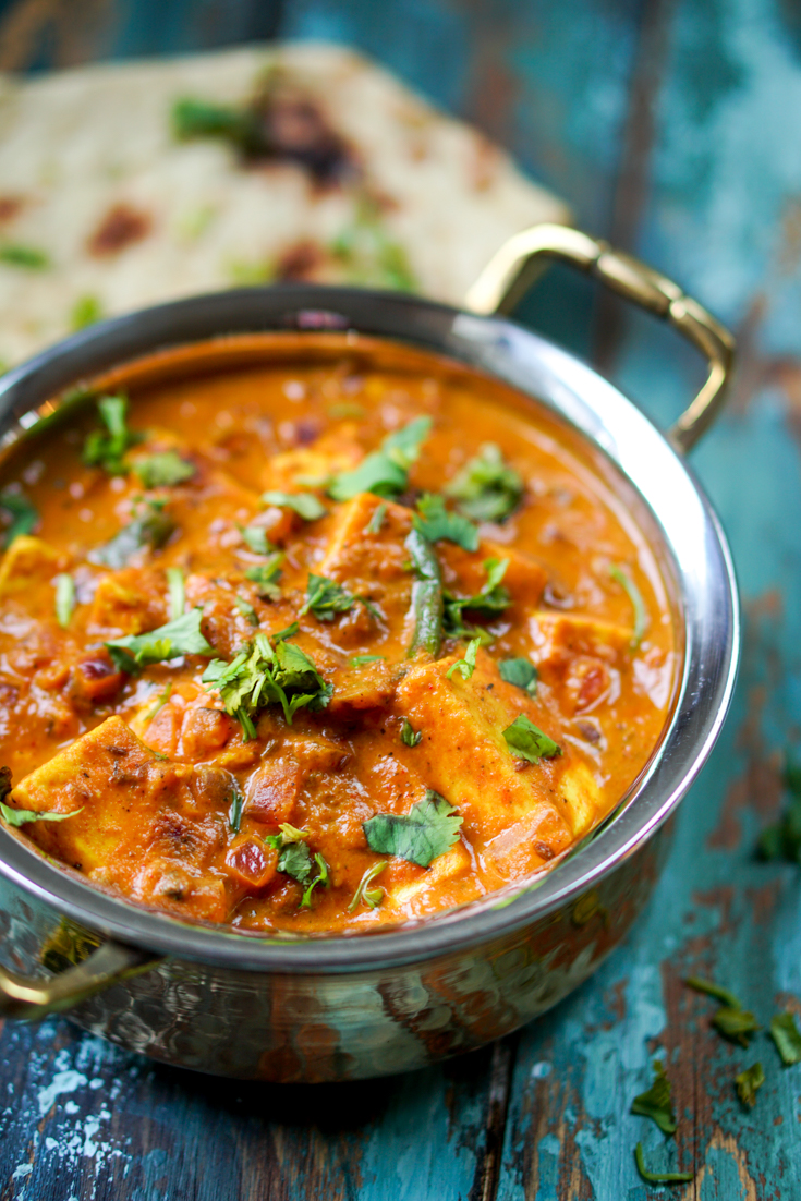 paneer masala in a copper and steel kadhai