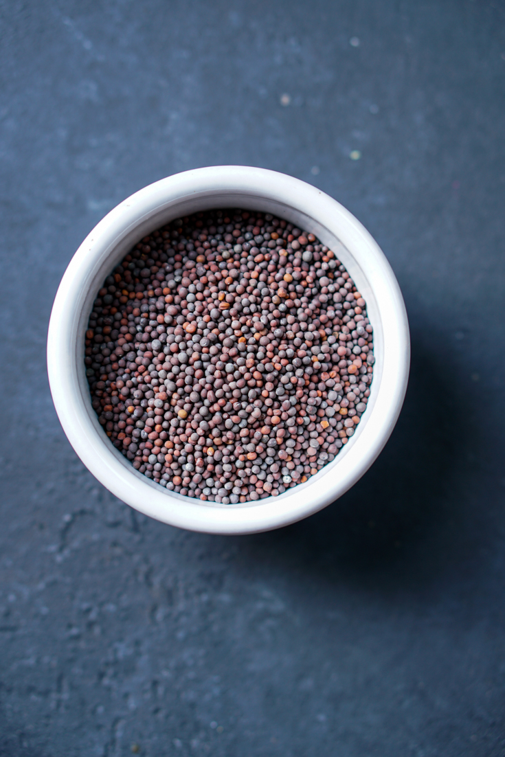 a bowl of brown mustard seeds