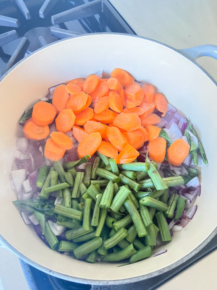 carrots and green beans in a Dutch oven