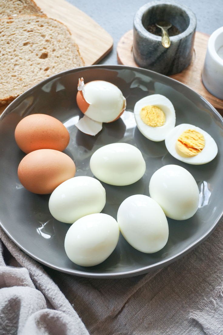 Eggs boiled and peeled in a black plate