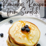 stack of pancakes on white plate with syrup pouring over it with text on image