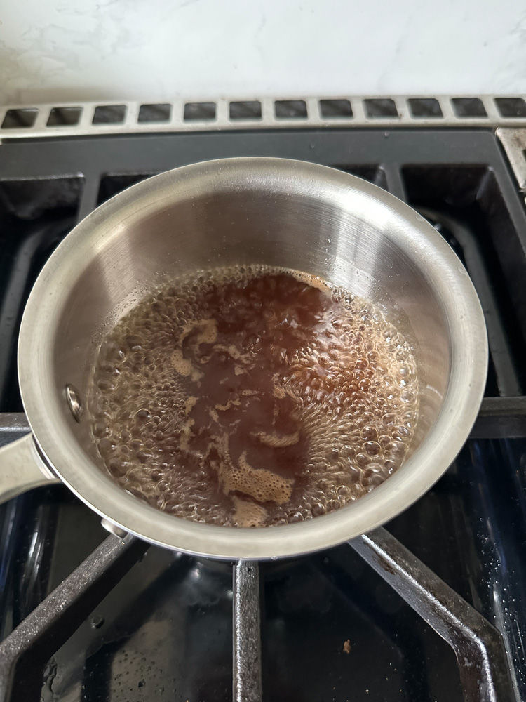 syrup boiling in a sauce pan on the stove top